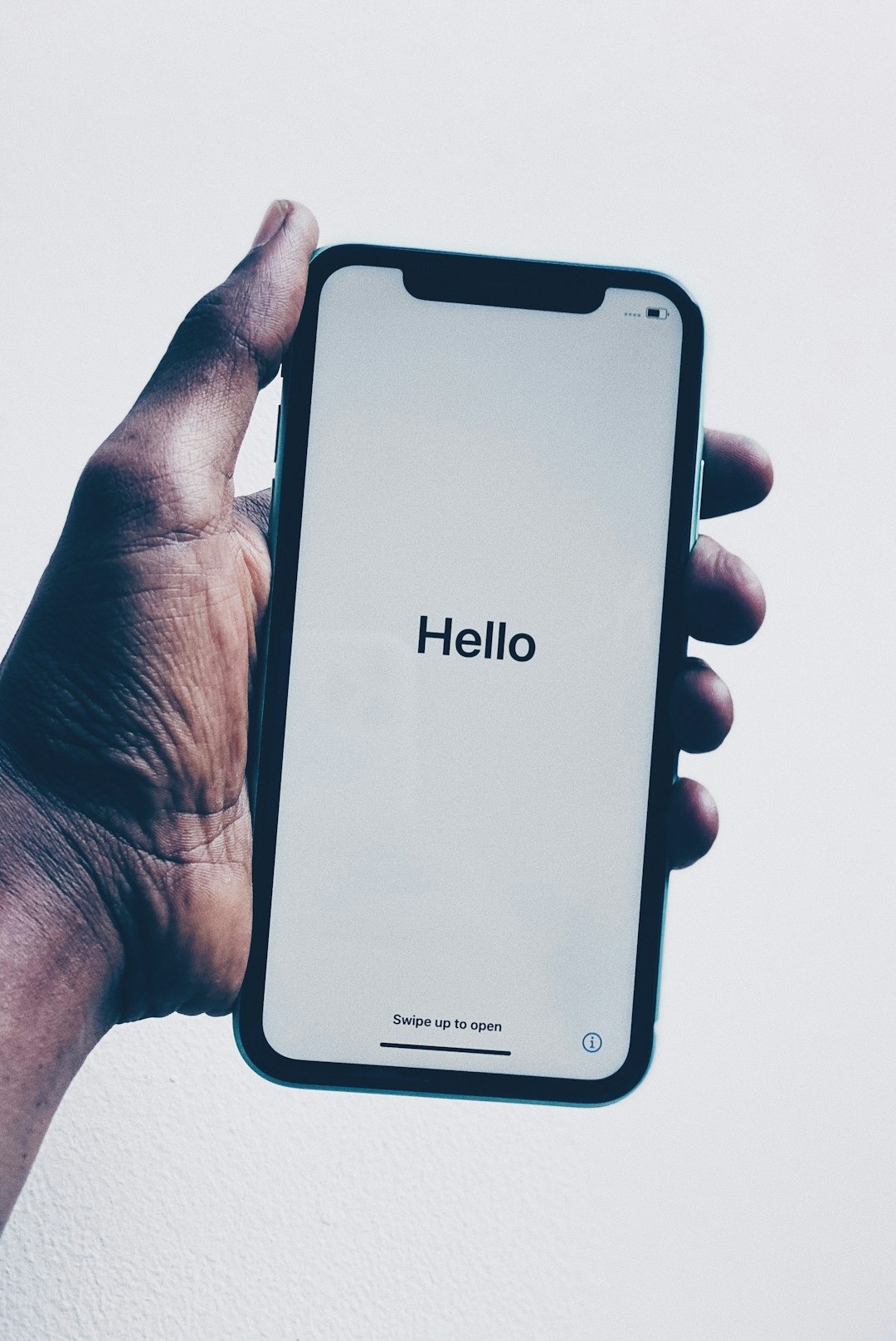 Hand holding a smartphone ready to place a call
